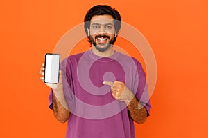 Positive hindu man showing nice online offer, mockup