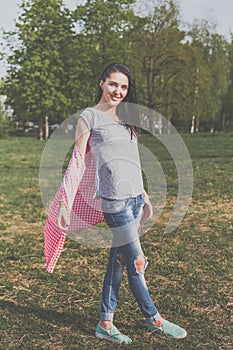 Positive hipster girl in green nature