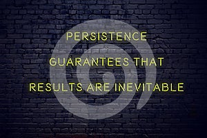 Positive inspiring quote on neon sign against brick wall persistence guarantees that results are inevitable