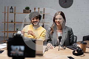 positive interracial podcasters in yellow jumper