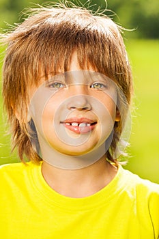 Positive kid in yellow T-shirt portrait