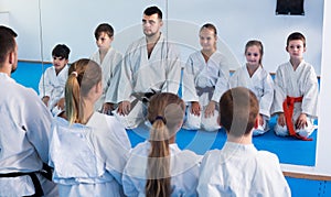 Positive kids sparring in pairs