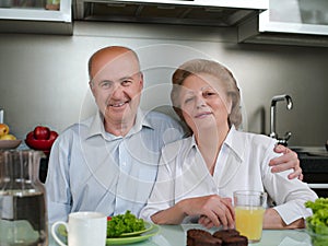 Positive loving aged coupel having breakfast,lunch,dinner