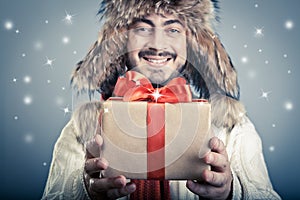 Positive male with magical giftbox photo