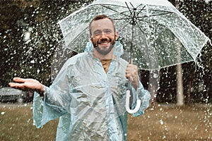 Positive man being happy in rain