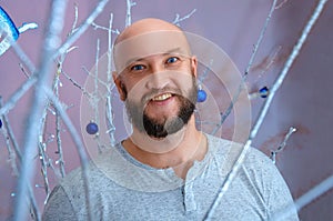 Positive man in Christmas decorations festive mood