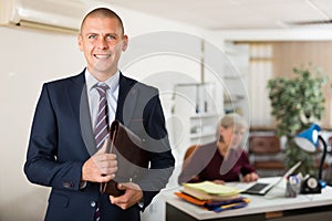 Positive man clerical worker with briefcase