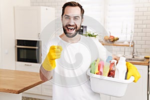 Positive man househusband indoors