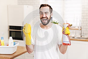 Positive man househusband indoors