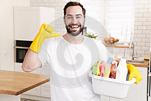 Positive man househusband indoors