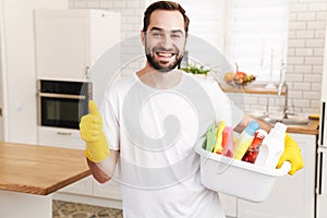 Positive man househusband indoors