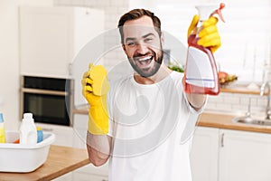 Positive man househusband indoors