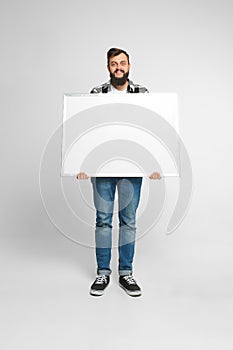 Positive man with mockup poster