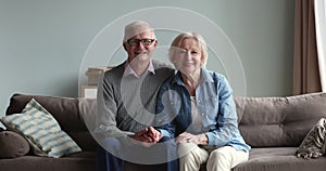 Positive married senior couple home headshot portrait