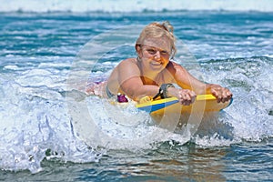 Positive mature woman surfing with fun on ocean waves