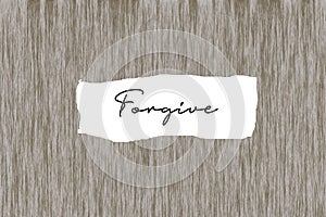 Positive message on wood wall - Forgive. Forgiving forgiveness concepts. Note to self. Self healing and freedom concept.