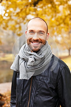 Positive middle-aged man on autumn day