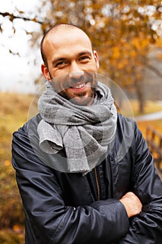 Positive middle-aged man on autumn day