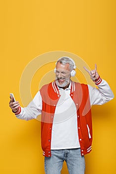 positive middle aged man in headphones