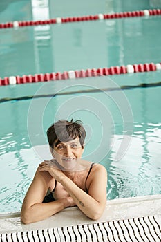 positive middle aged woman with short