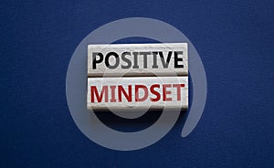 Positive Mindset symbol. Concept words Positive Mindset on wooden blocks. Beautiful deep blue background. Business and Positive