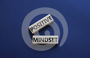 Positive Mindset symbol. Concept words Positive Mindset on wooden blocks. Beautiful deep blue background. Business and Positive