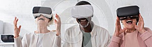 Positive multiethnic pensioners using vr headsets