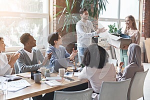 Positive multiracial business team greeting new employee