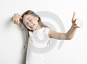 Positive Portrait of cute, confident 9 years old girl, isolated on white photo