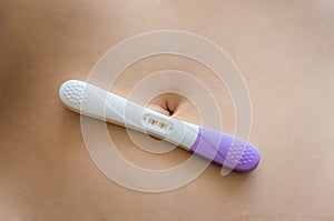 Positive pregnancy test on belly