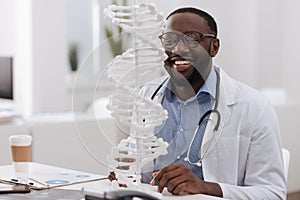 Positive professional scientist studying DNA