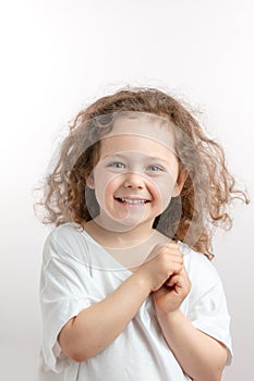 Positive red-haired kid posing to the camera