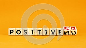 Positive results and mind symbol. Concept words Positive results or Positive mind on wooden cubes. Beautiful orange table orange