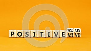 Positive results and mind symbol. Concept words Positive results or Positive mind on wooden cubes. Beautiful orange table orange