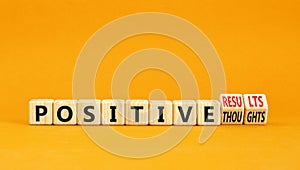 Positive results thought symbol. Concept words Positive results or Positive thoughts on cubes. Beautiful orange table orange