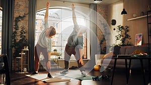 Positive Senior Couple Doing Gymnastics and Yoga Stretching Exercises Together at Home on Sunny