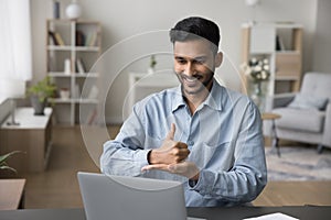 Positive sign language therapist speaking with gestures on video call