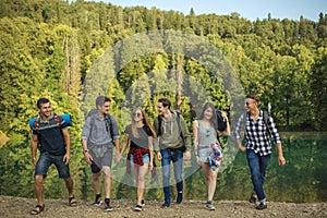 Positive, smiling young people are fond of traveling