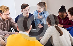 Classmates having round of Werewolf game at break between classes