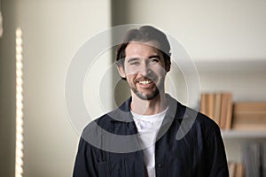 Positive successful millennial business professional man head shot portrait