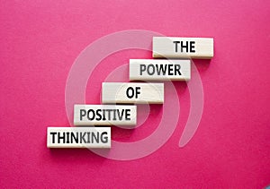 Positive Thinking symbol. Wooden blocks with words The Power of Positive Thinking. Beautiful red background. Positive Thinking