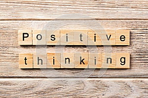 Positive thinking word written on wood block. positive thinking text on table, concept