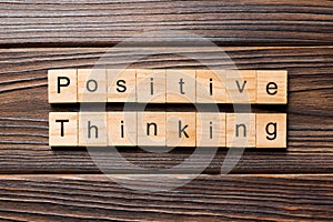 Positive thinking word written on wood block. positive thinking text on table, concept