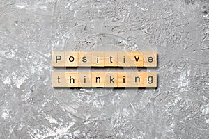 Positive thinking word written on wood block. positive thinking text on table, concept