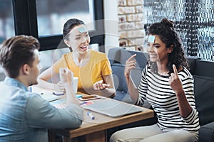 Positive three friends playing game