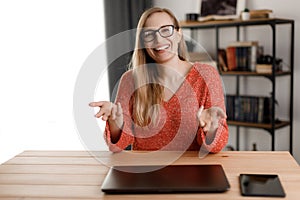 Positive woman at home office