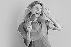 positive woman with icelolly ice cream on background. photo of woman with icelolly ice cream