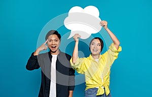 Positive young asian woman in casual hold abstract cloud with free space, man got idea, point finger at head