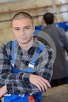 Positive young garage worker