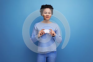 positive young latin 20c woman holding card mockup